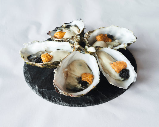 Pacific Oysters topped with Sea Urchin Oyster and Black Caviar / Each